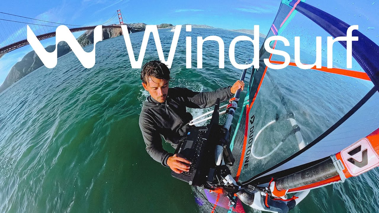 Windsurf IDE showing the Cascade agent composing a multi-file code change with the chat panel and editor both visible