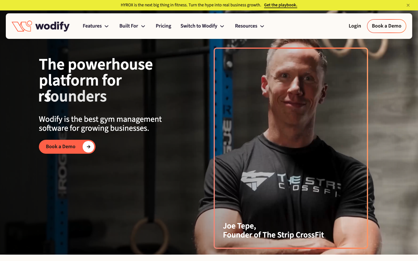 Wodify gym management software homepage with CrossFit workout tracking and member management features